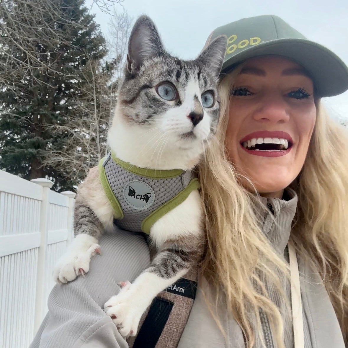 Women exploring with cat outside 